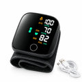 Black digital blood pressure monitor with fabric cuff and USB charging cable